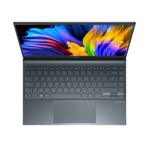 Un portátil ASUS ZenBook abierto, visto desde arriba, mostrando el teclado y el panel táctil.