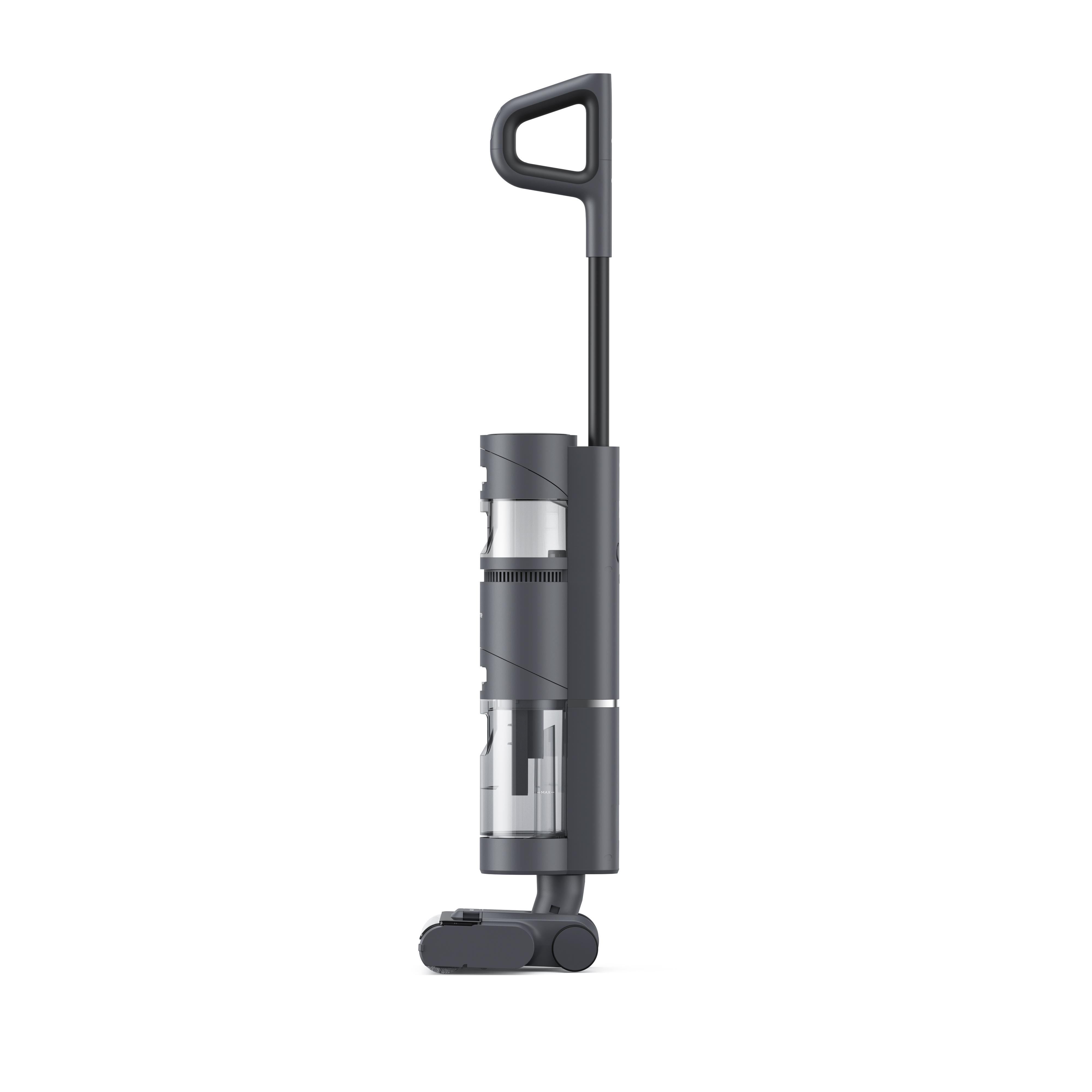 Ein grauer Staubsauger, Seitenansicht, auf weißem Hintergrund. Griff oben.