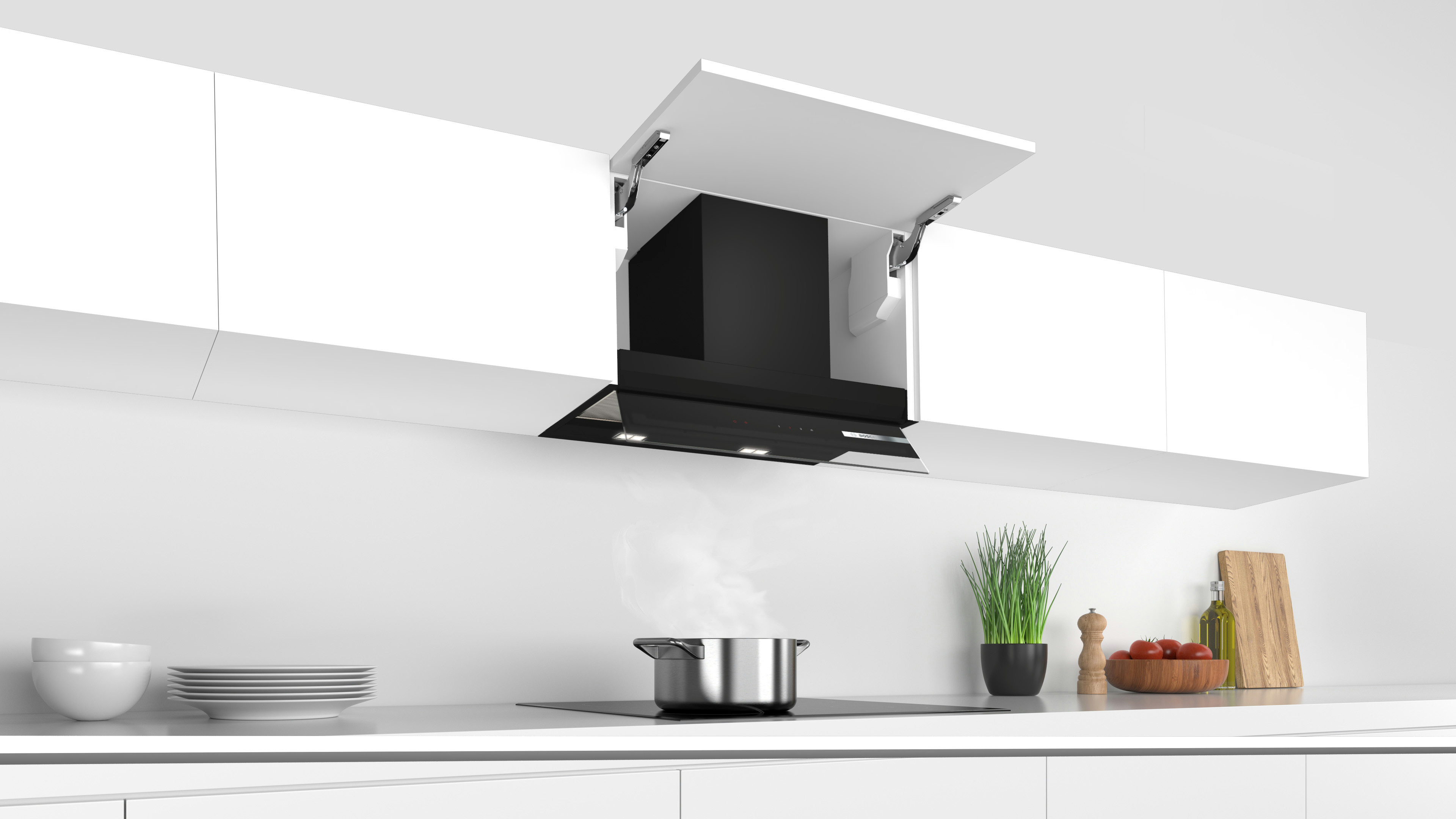 Cocina moderna con una campana extractora negra sobre una estufa.
