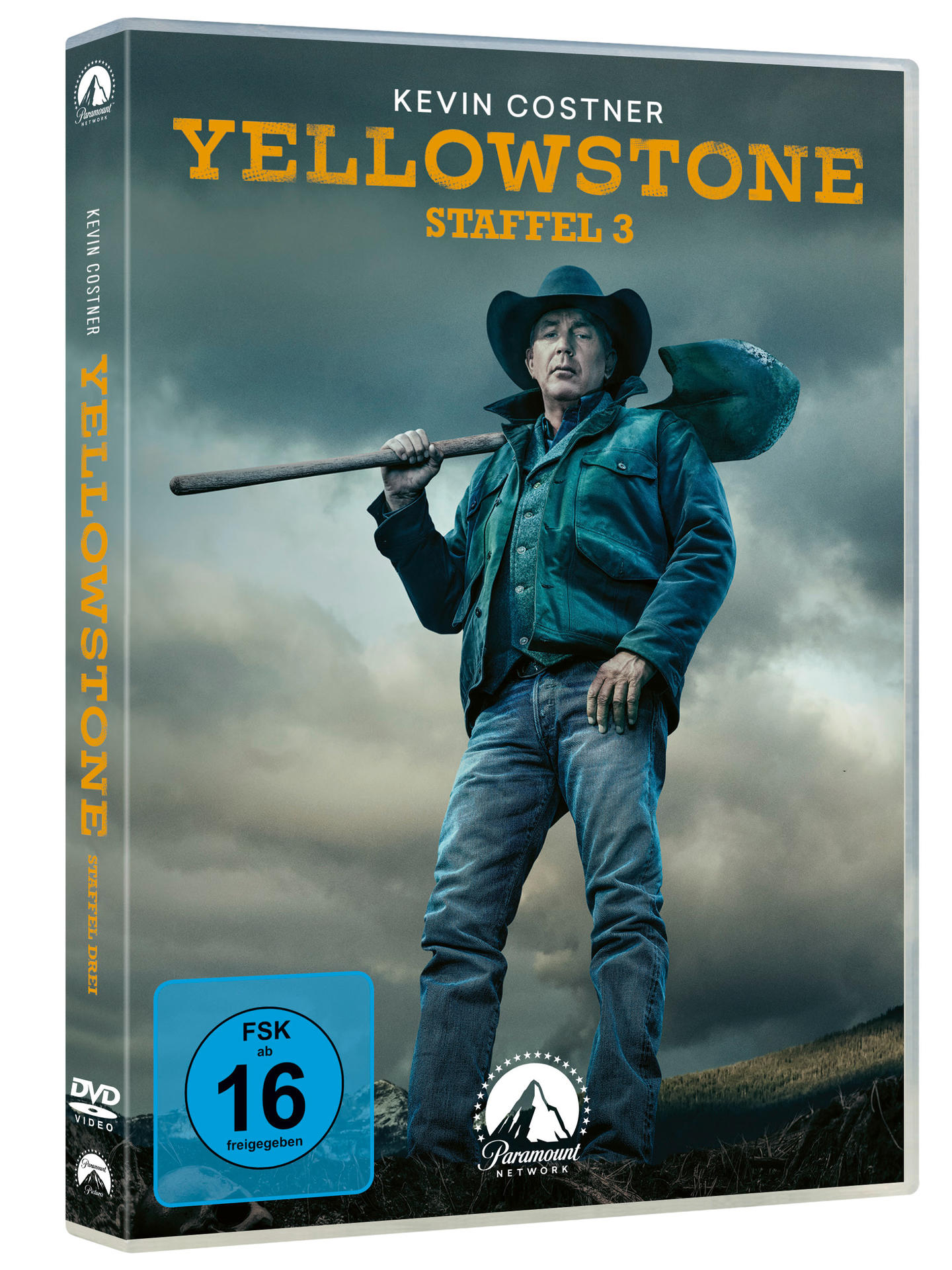 Yellowstone Staffel 3 DVD-Hülle. Kevin Costner hält einen Spaten in einer bewölkten Szene.