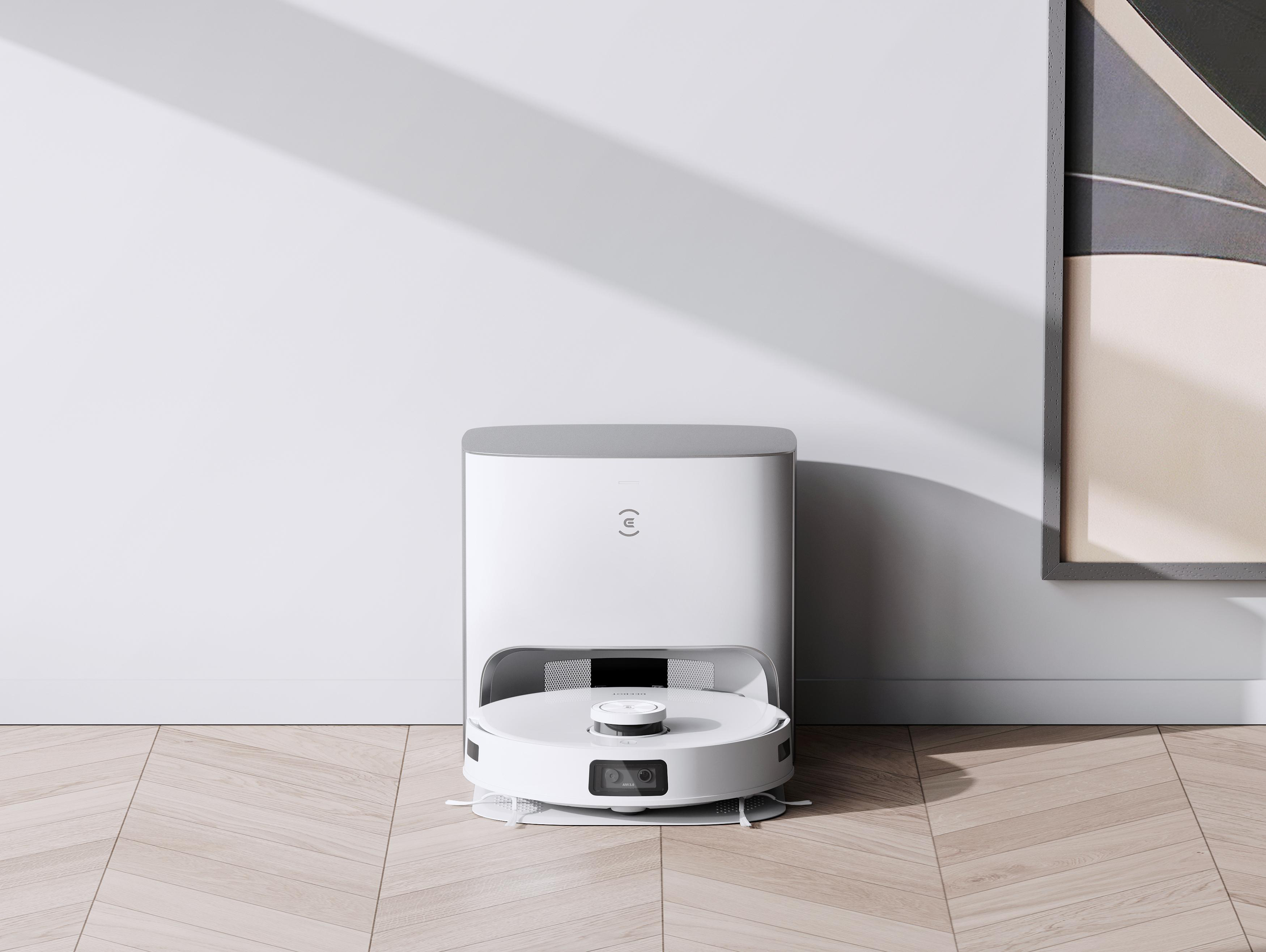Weißer und grauer Roboter-Staubsauger auf Holzboden.