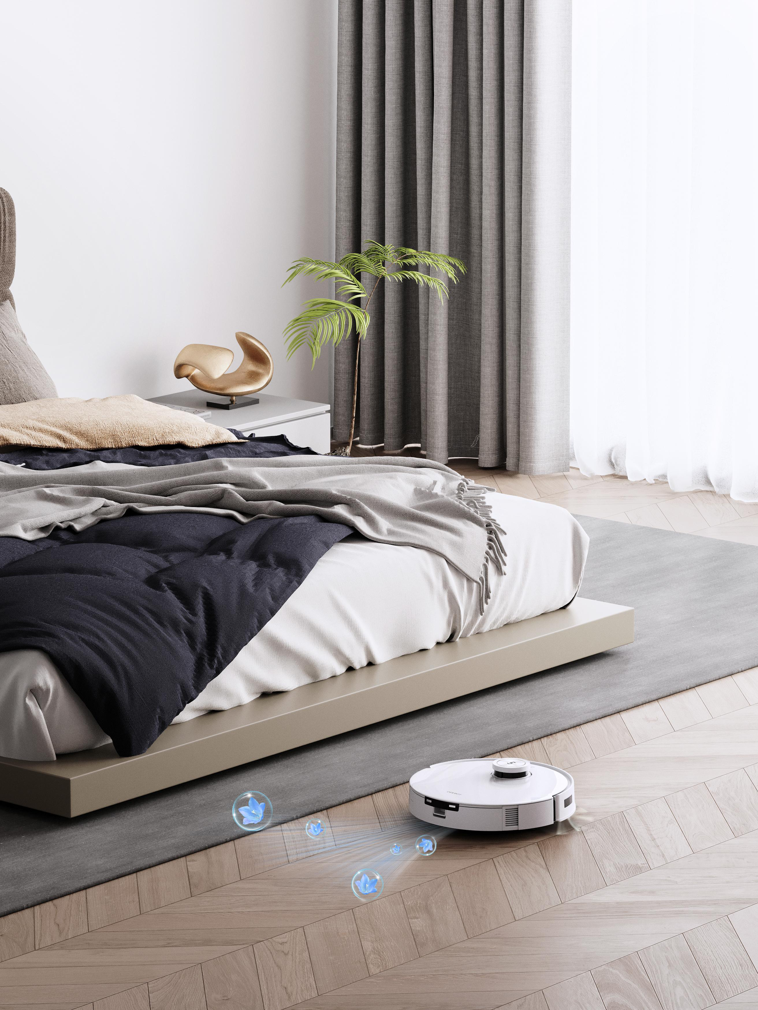 Ein Roomba-Staubsauger reinigt einen Raum. Ein Bett und Vorhänge sind im Hintergrund. Eine kleine Pflanze steht.