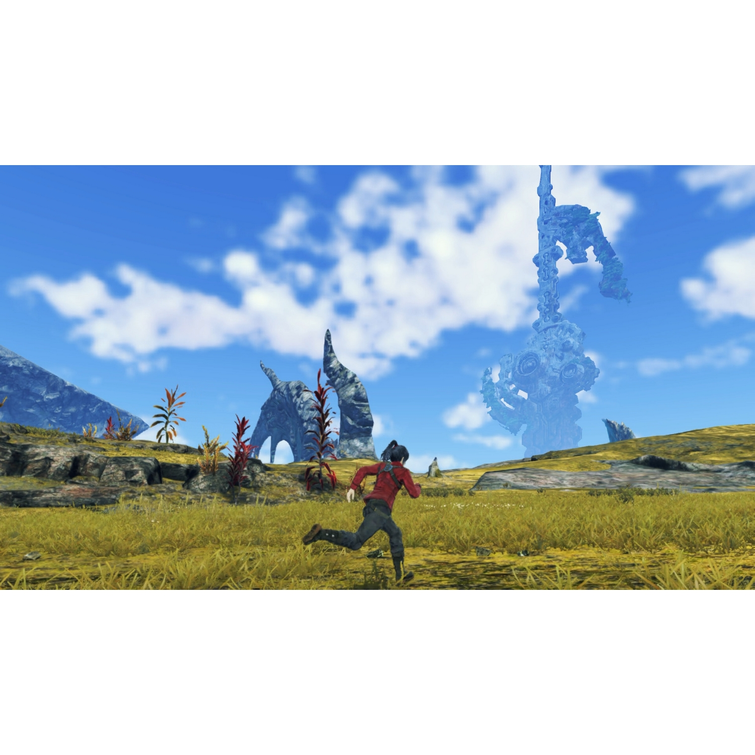Una persona corre por un campo de hierba. A lo lejos, hay extrañas formaciones rocosas bajo un cielo azul.