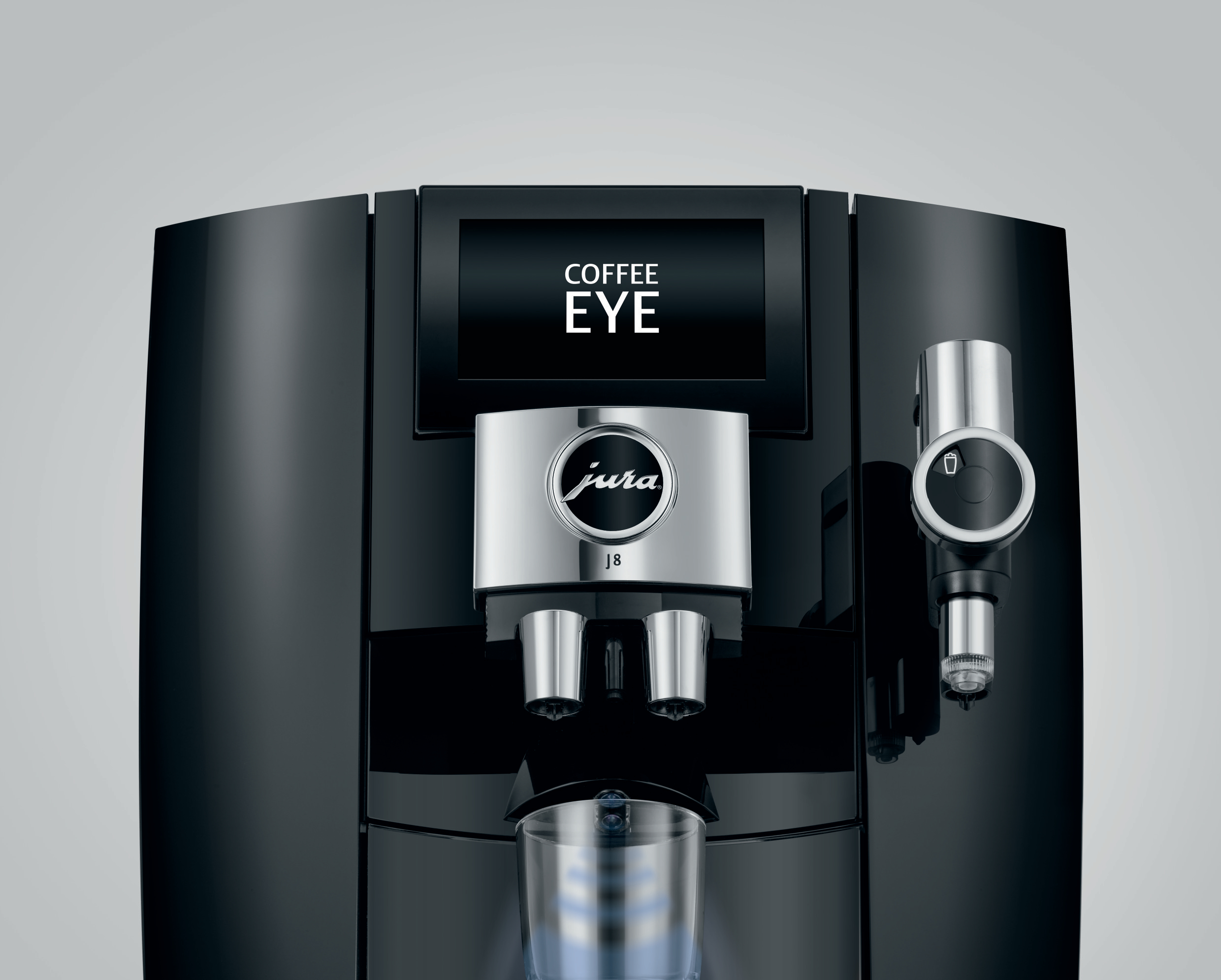 Eine schwarze Jura J8 Kaffeemaschine mit Bildschirm und zwei Tassenauslässen.