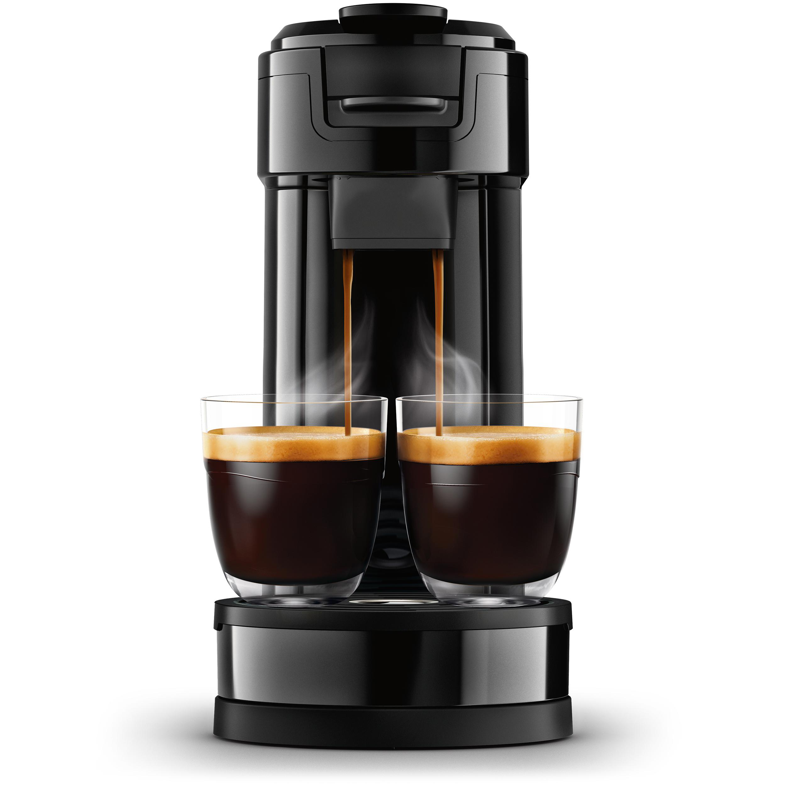 Schwarze Espressomaschine mit zwei Gläsern, die sich mit Kaffee füllen, Dampf steigt auf.