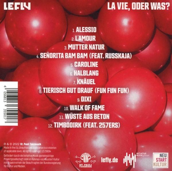 Albumcover mit roten Kugeln und Text auf rotem Hintergrund.