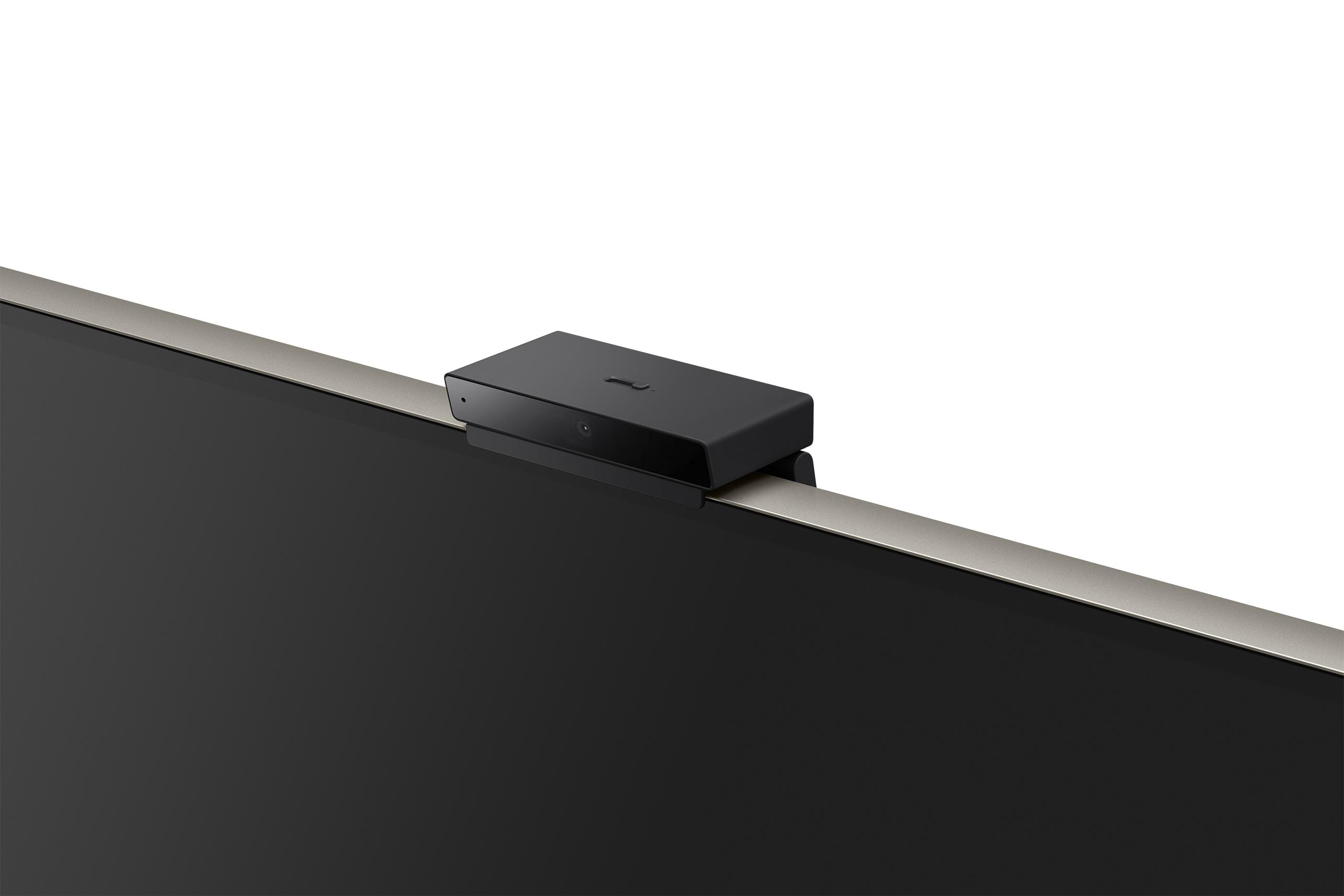 Schwarze Webcam, die oben an einem Monitor befestigt ist.