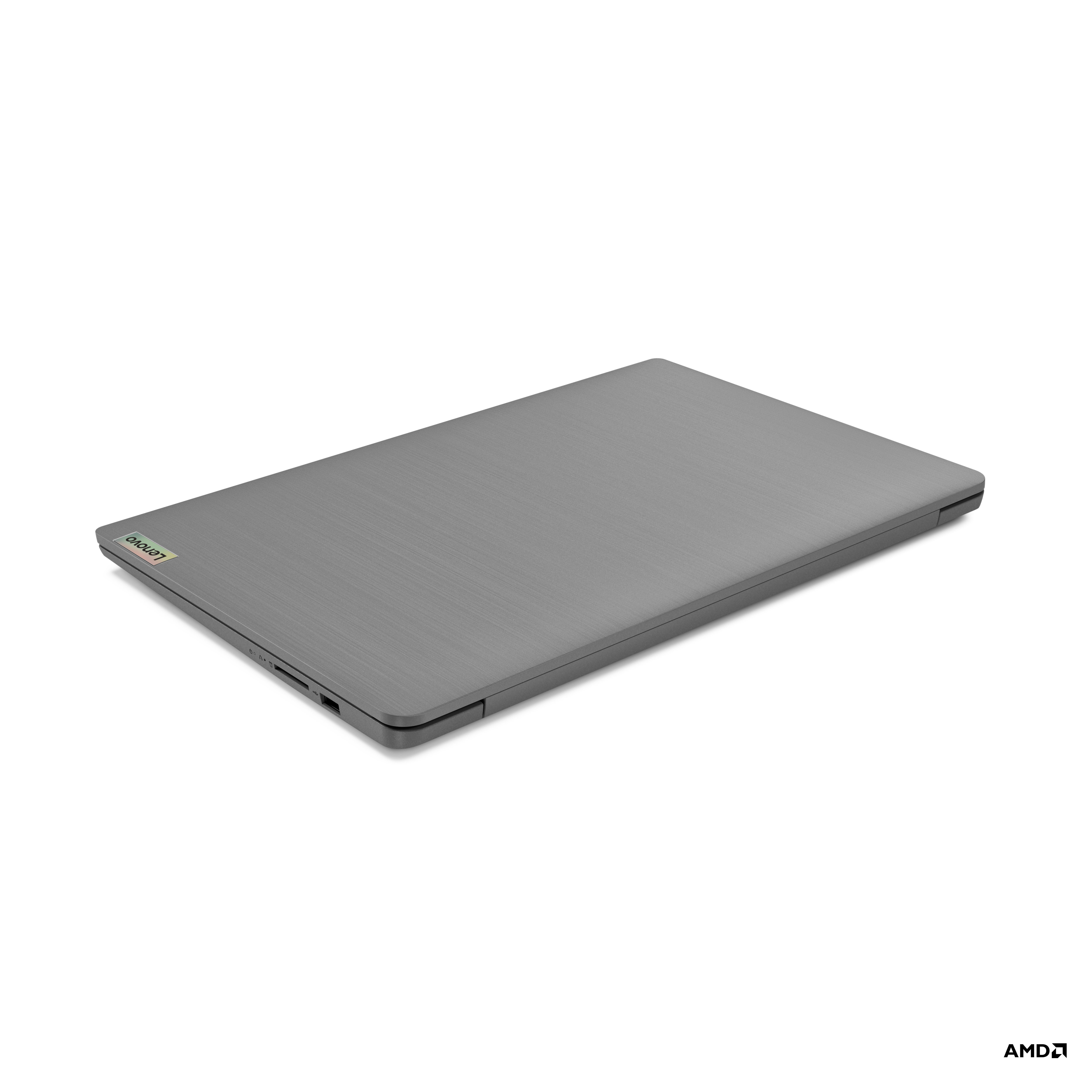 Kapalı gri bir Lenovo dizüstü bilgisayar. Logo görülebilir. Arka plan beyaz.