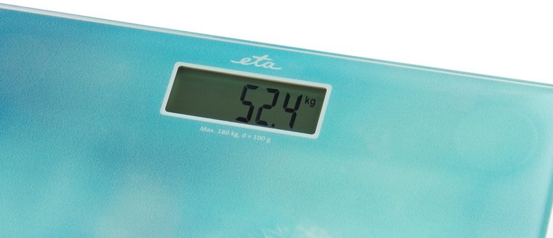 Digitális mérleg 52,4 kg-ot mutat. Kék-fehér felület.