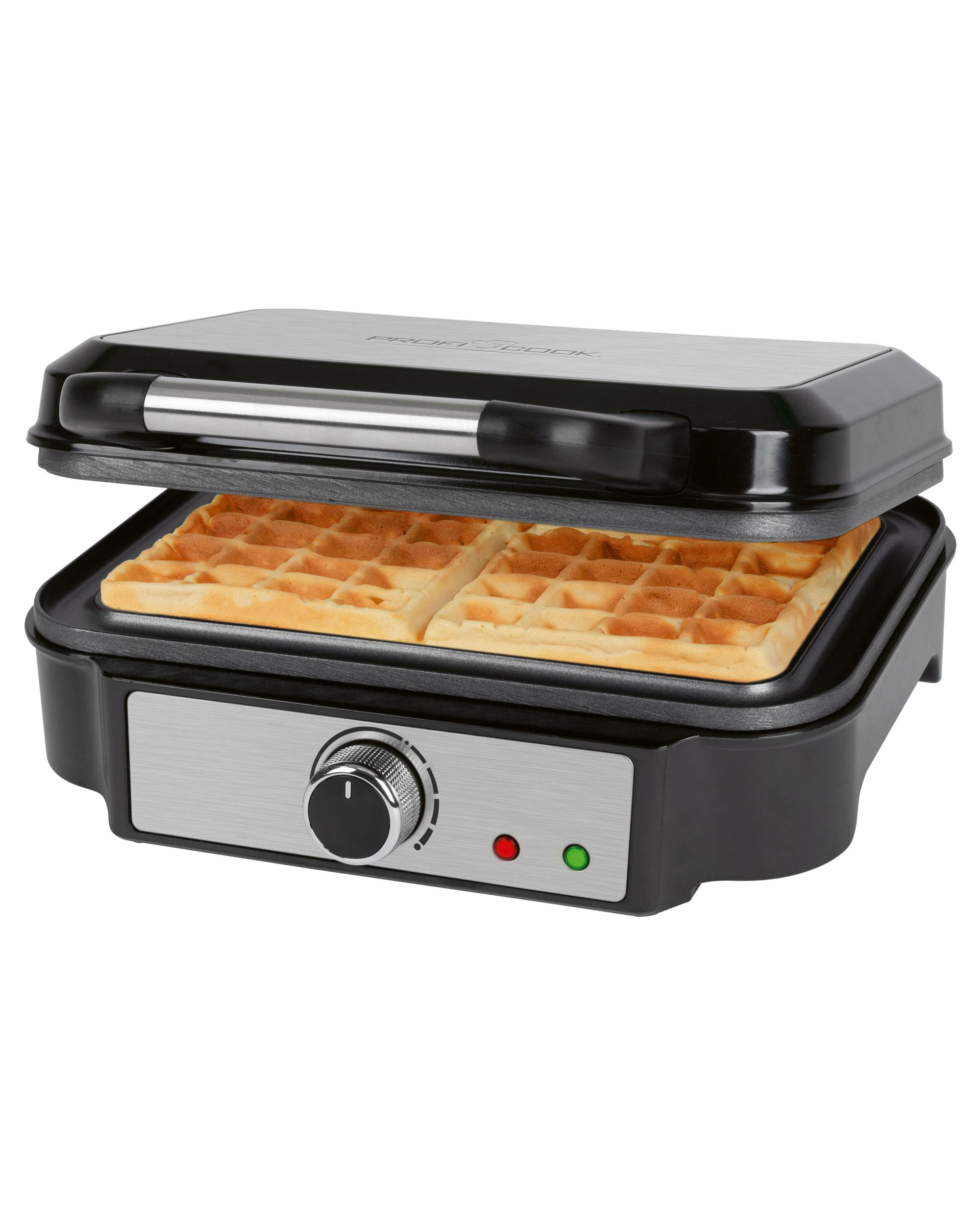 Schwarz-silberner Waffeleisen mit zwei Waffeln im Inneren, Deckel geöffnet. Ein Drehknopf und Kontrollleuchten sind zu sehen.