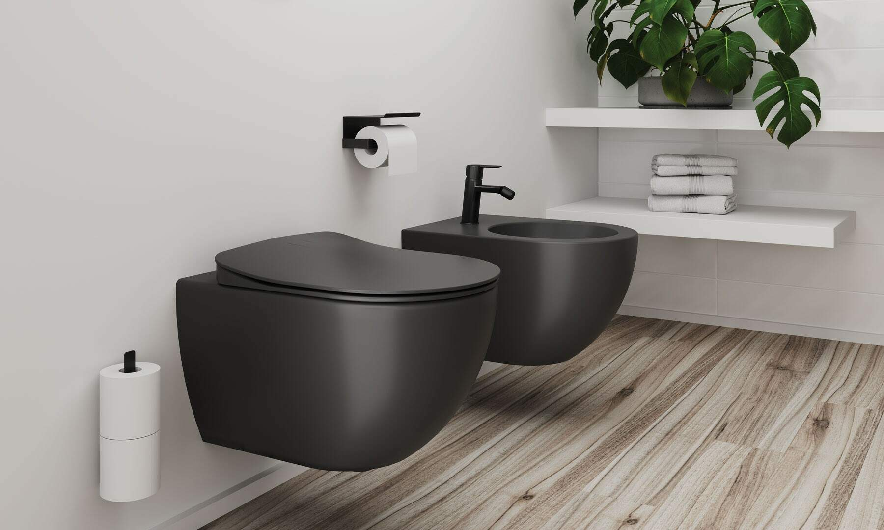 Modern fürdőszoba két fekete falra szerelt WC-vel és bidével.