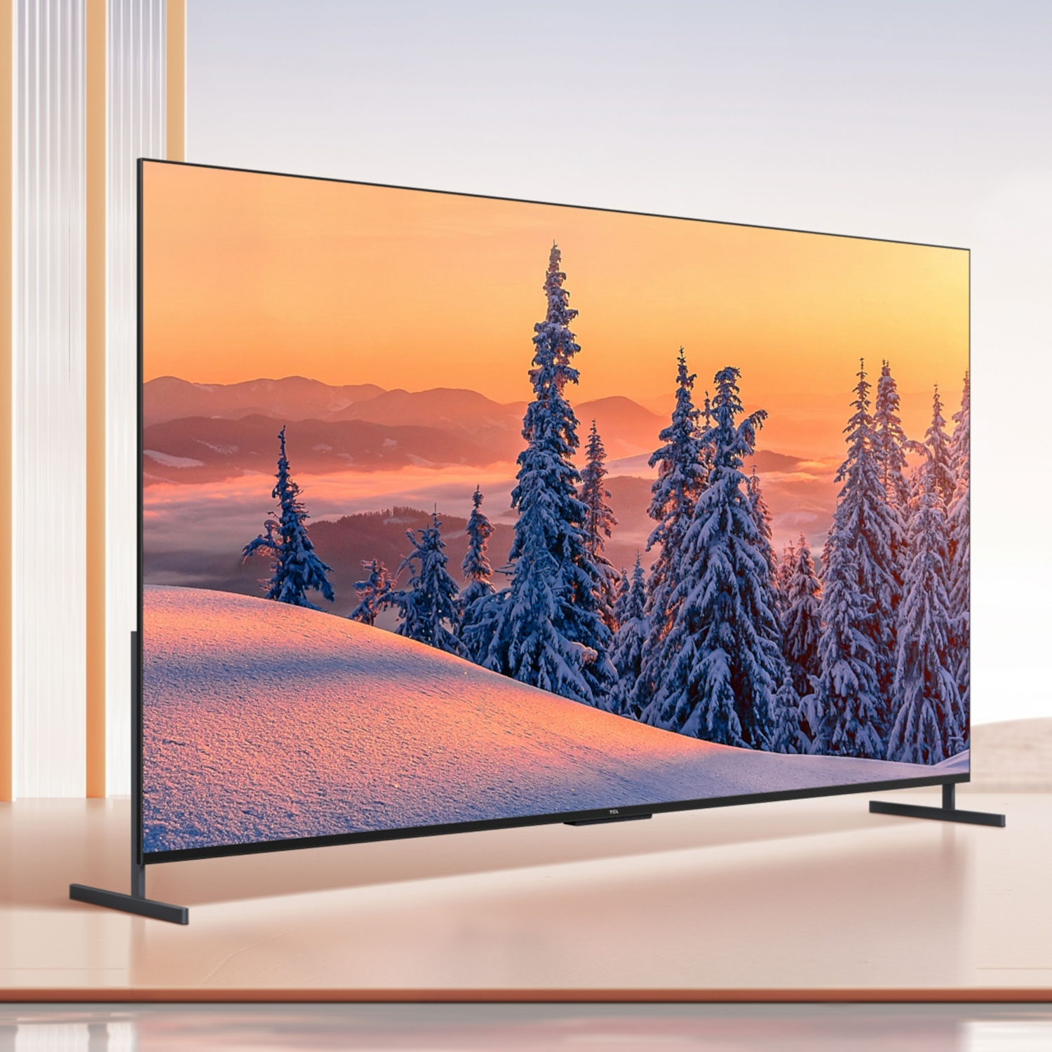 Large TV displays a winter scene. Snow-covered trees and hills are in the background, with a sunset.