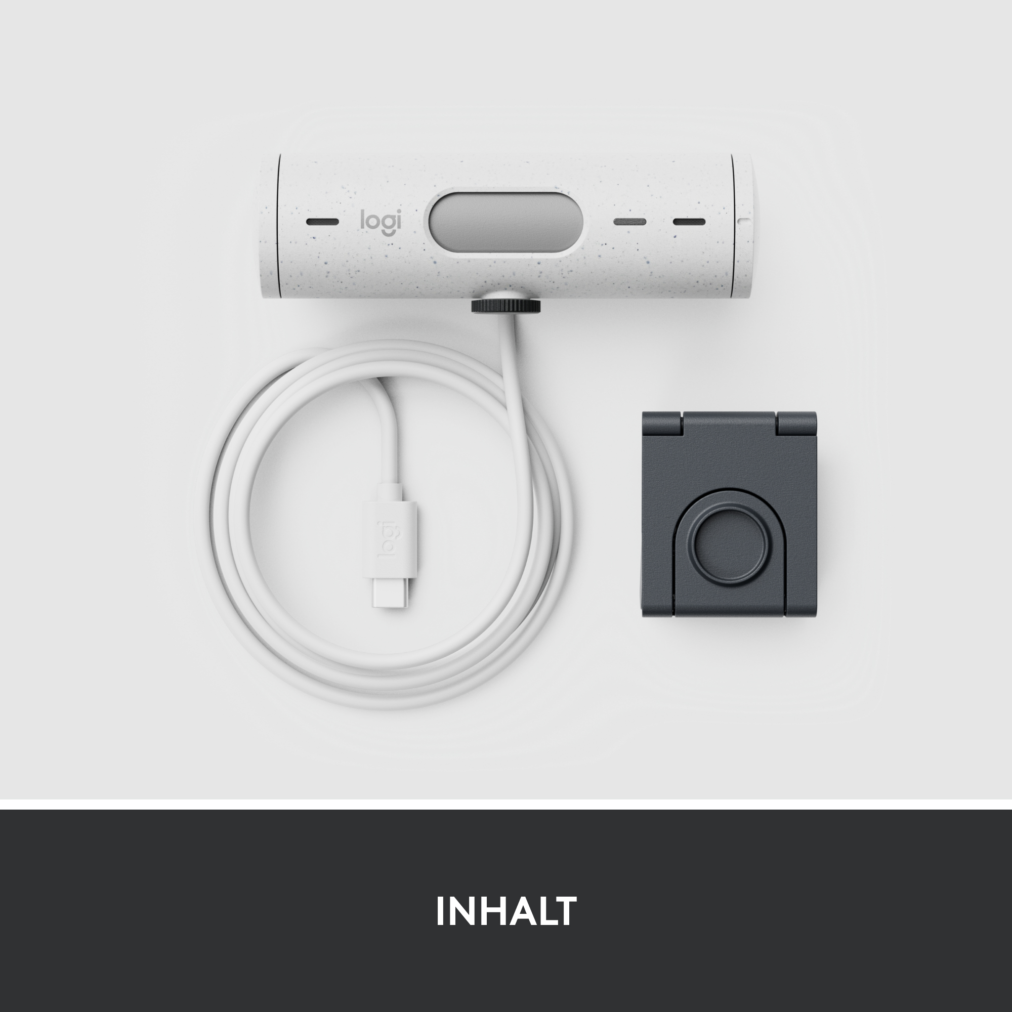 Weißes Gerät mit Kabel und schwarzem Zubehör. Text: Inhalt.