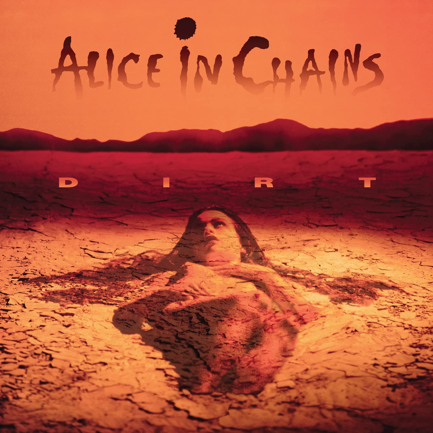 Album borító: Nő homokba temetkezve. Cím: Dirt, Alice in Chains.