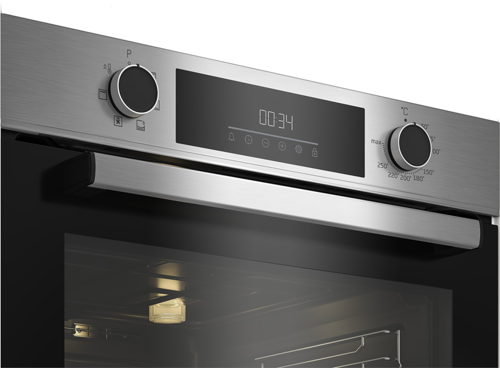 A close-up view of an oven control panel with a digital display and knobs.