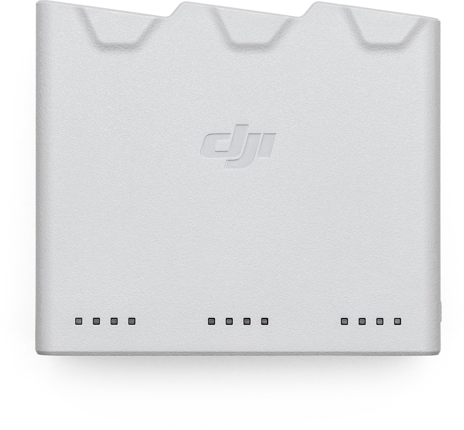 A white DJI drone battery charger with the DJI logo.