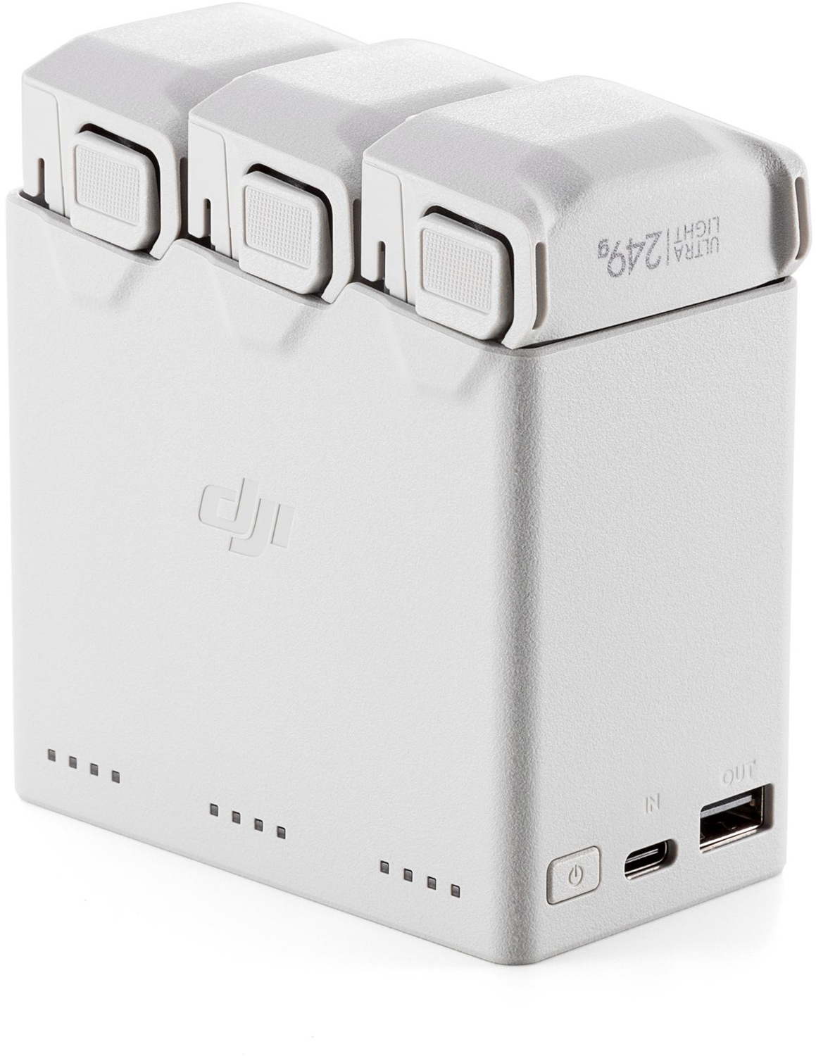 A white charging station for a DJI Mini 3 Pro drone. Three batteries are docked on top. The word 'DJI' is on the front.