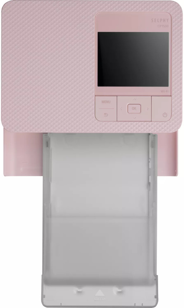 Pink photo printer with screen and paper tray, white background.