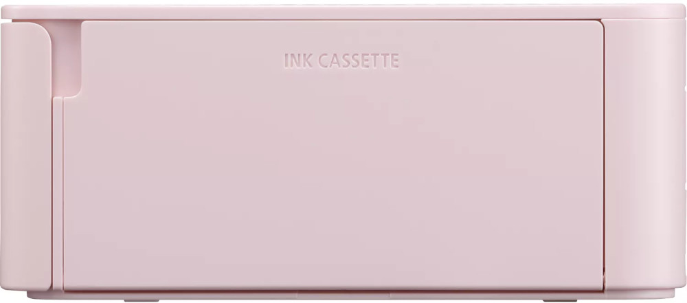 A pink ink cassette for a printer. The text 'INK CASSETTE' is written on the front of the cassette.