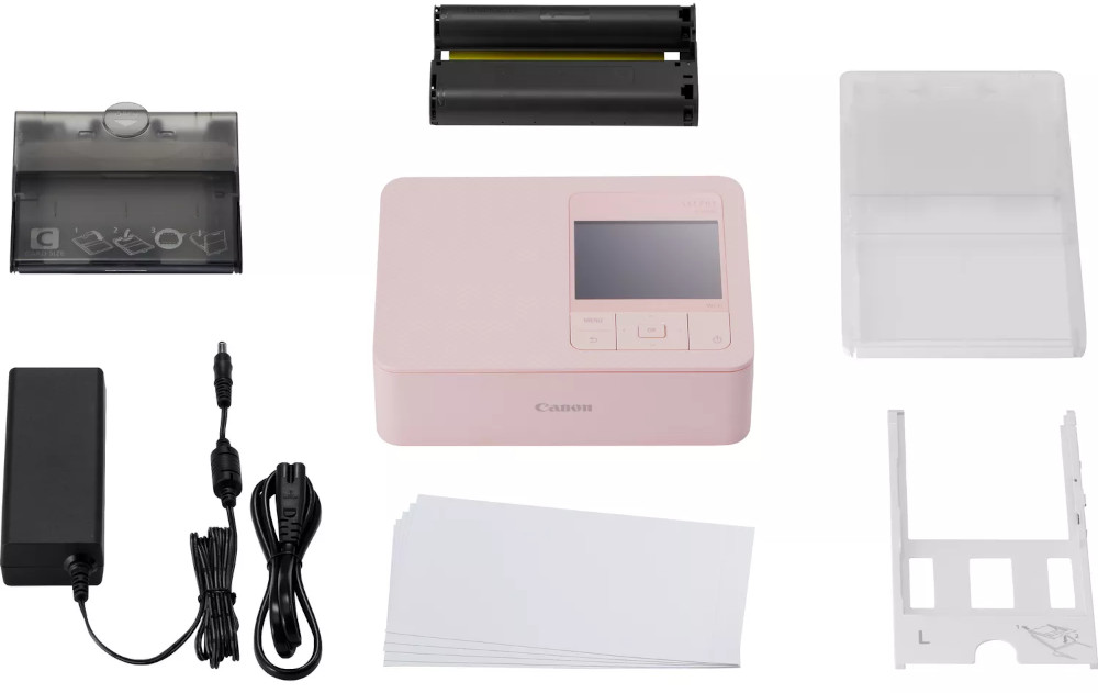 Pink Canon SELPHY printer and related accessories, displayed against a white background.
