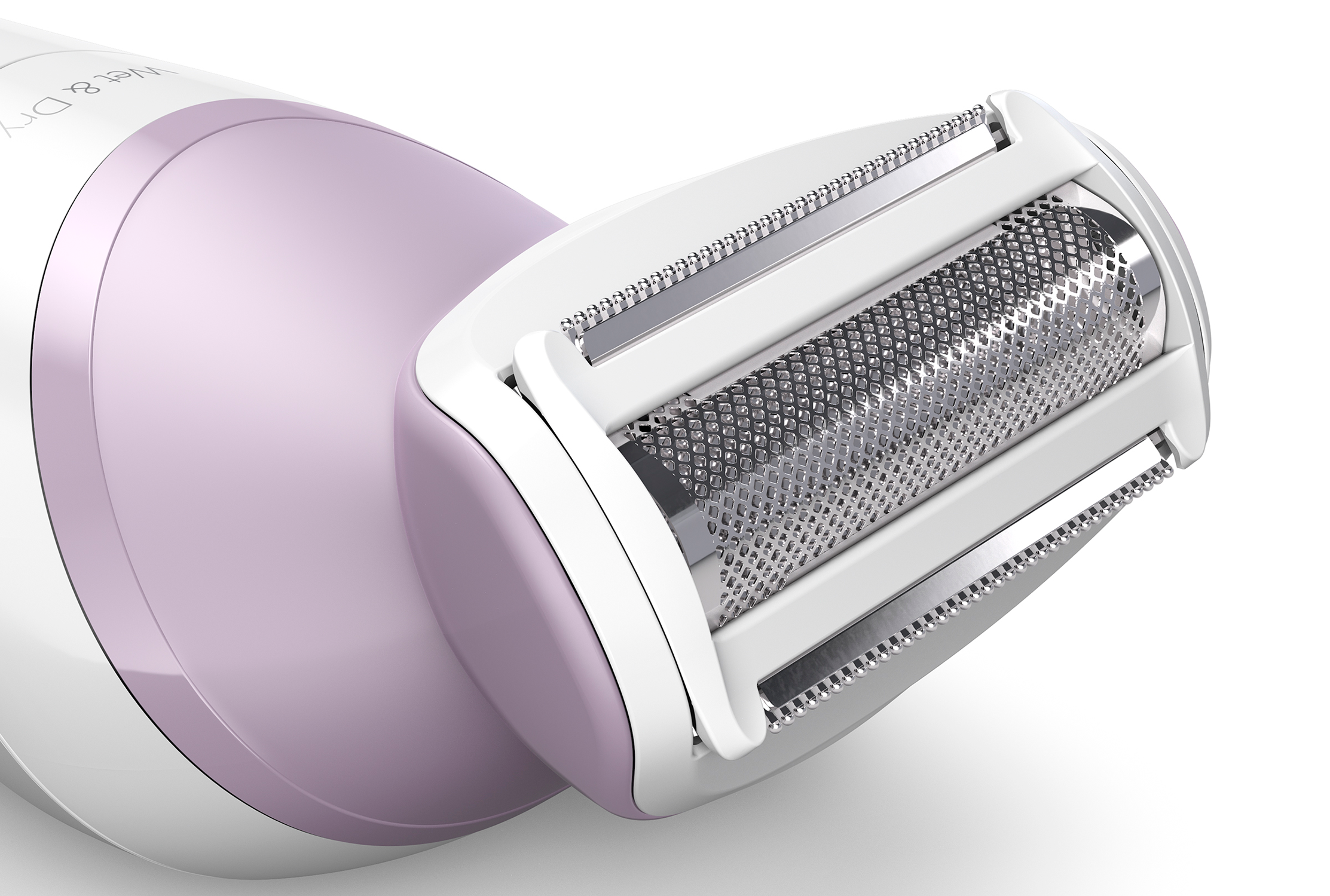 Close-up of a white and lavender epilator head. The head has blades and a rotating roller.