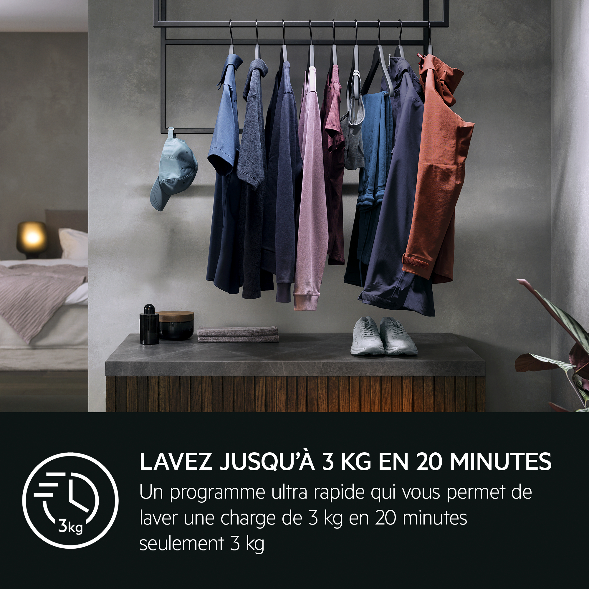Clothes hang on a rack. A bed is visible. Shoes sit on a shelf.