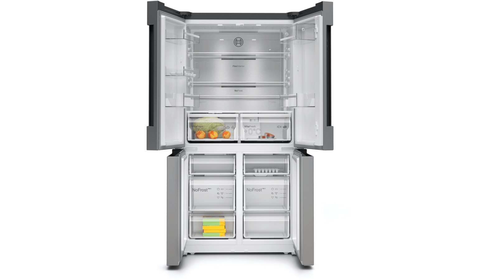 Refrigerador abierto con comida dentro. Se ven estantes, cajones y compartimentos. Frutas en el centro.