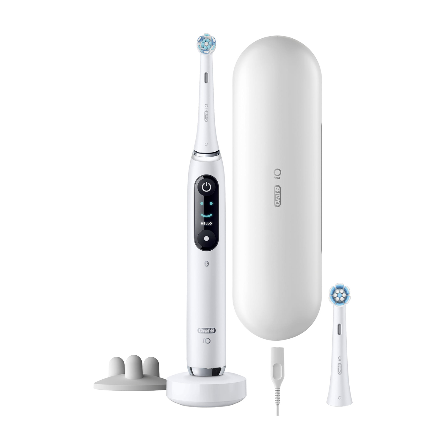 Spazzolino elettrico Oral-B bianco con custodia, testina extra e base di ricarica.