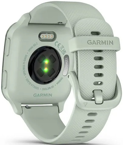 A light green smartwatch with a band, back view with sensors and the Garmin logo.