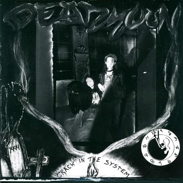 Albumcover: Zwei Personen in einem dunklen Raum, mit einer Zeichnung eines Schädels.