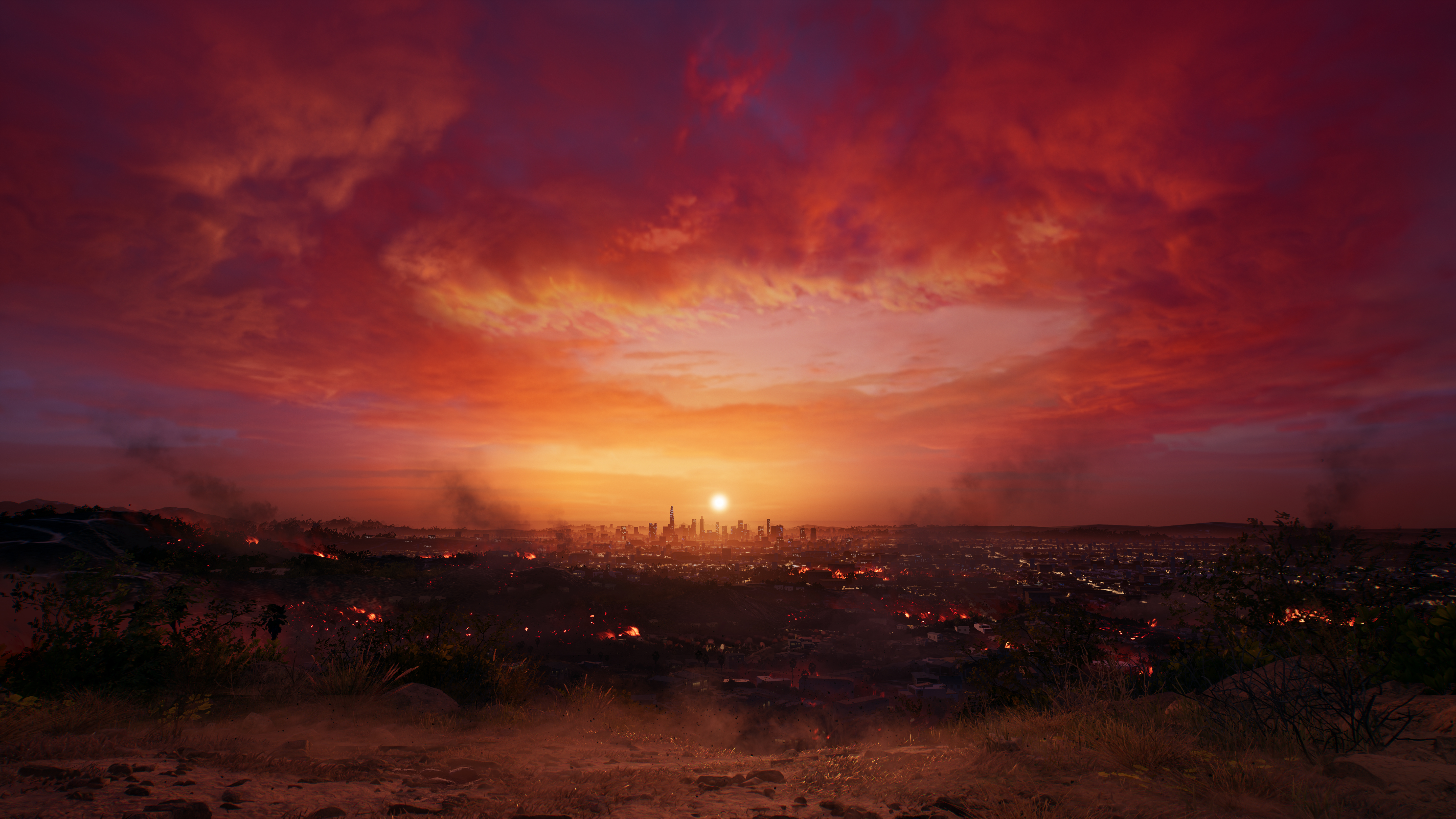 Coucher de soleil sur une ville. Des nuages rouges et oranges remplissent le ciel.