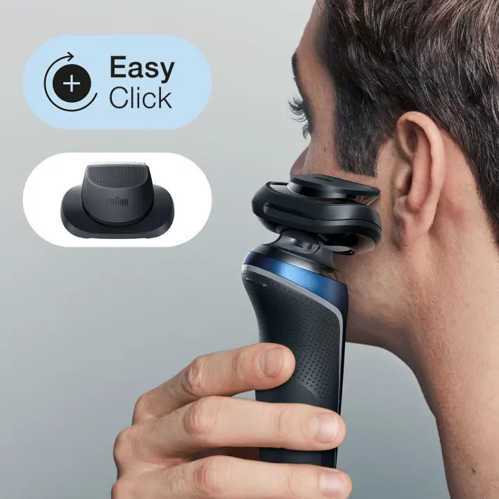 A man shaves his face with a black and blue electric shaver, with an extra head on the left.