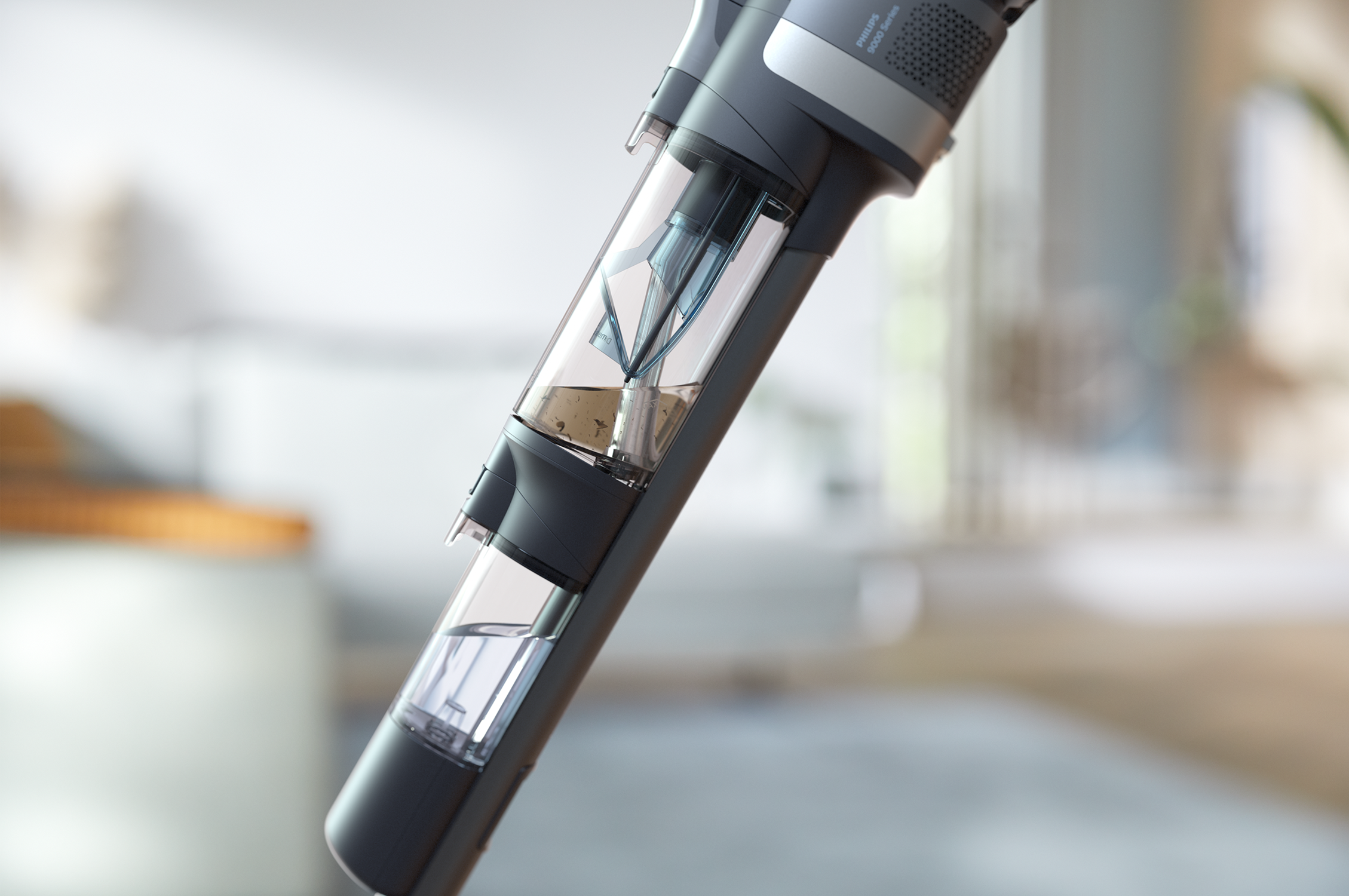 Close-up of a vacuum cleaner's transparent dust container.