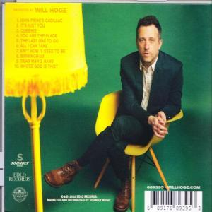 Ein CD-Cover mit einem Mann im Anzug, der auf einem gelben Stuhl sitzt. Der Hintergrund ist grün.