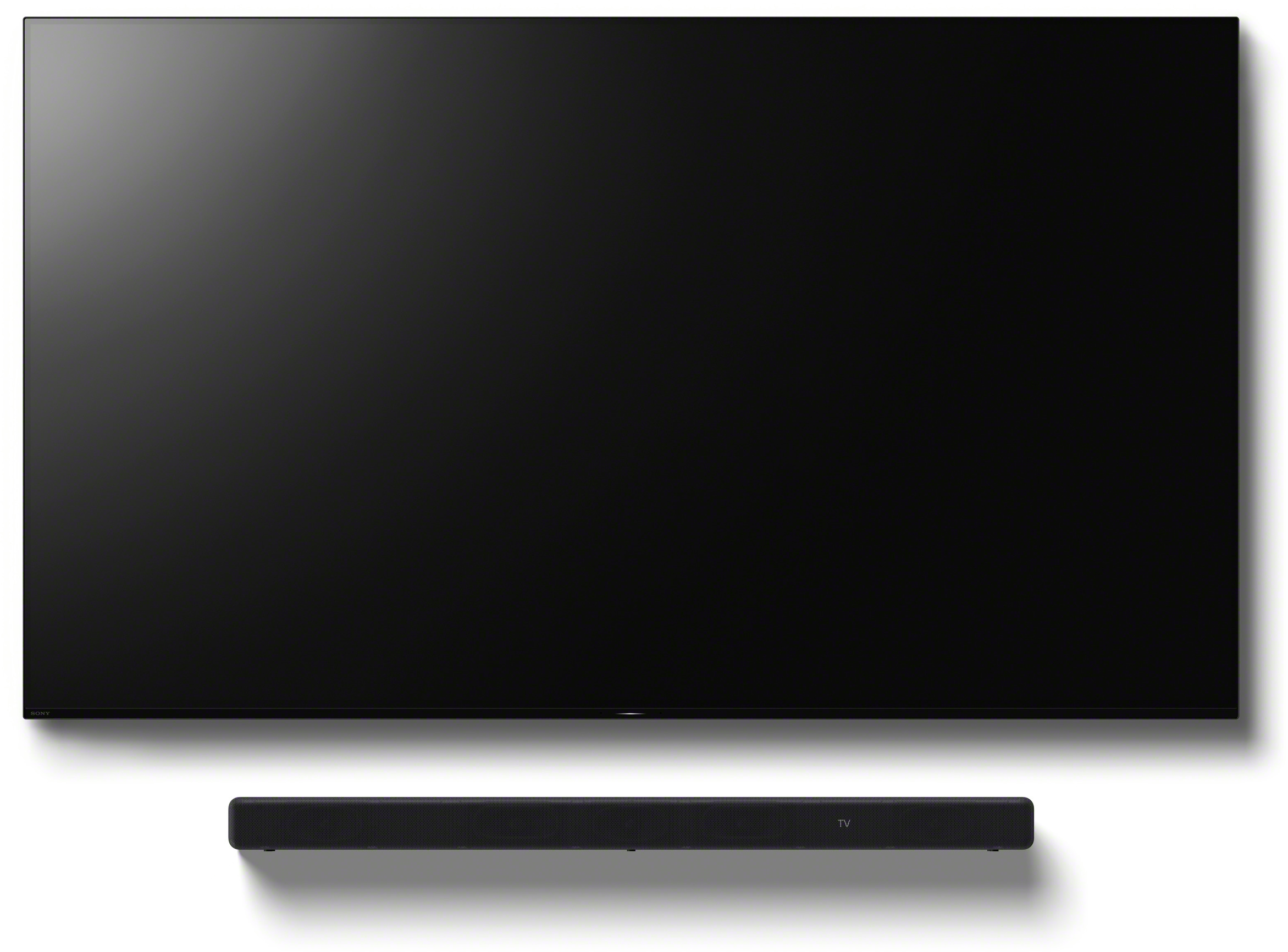 TV et barre de son noirs sur fond blanc. La TV est au-dessus de la barre de son. Les deux sont centrés.