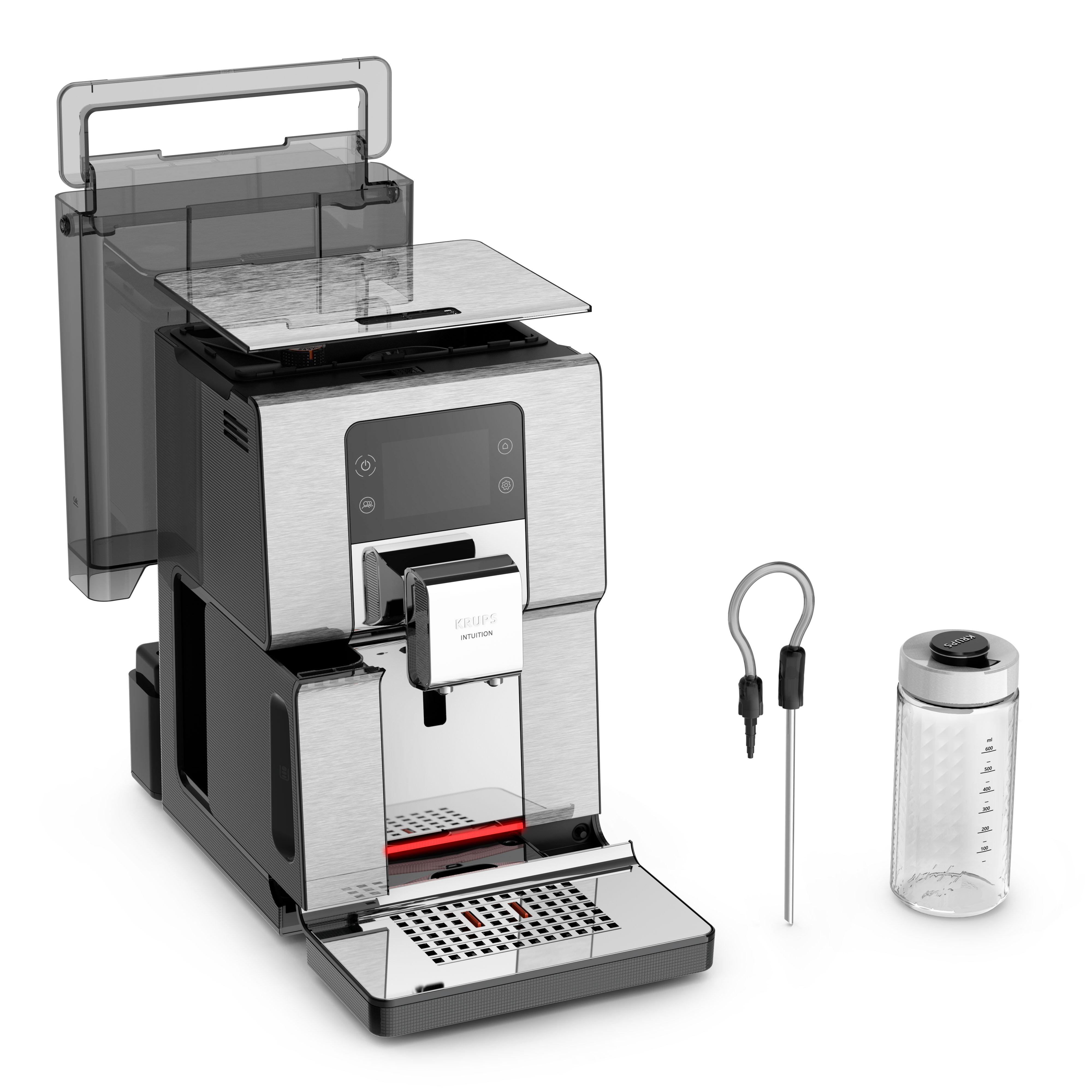 Kaffeemaschine, teilweise zerlegt. Silber mit schwarzen Akzenten und transparenten Teilen.