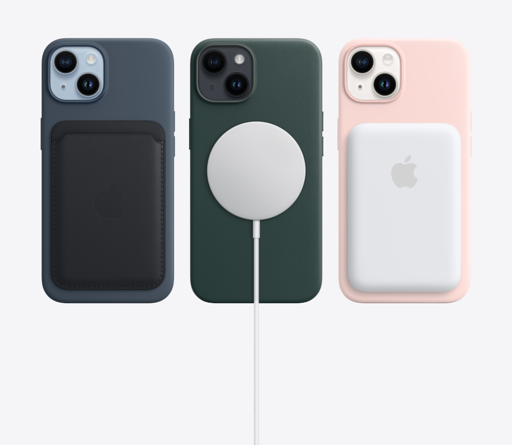 Three iPhone cases with Apple accessories: MagSafe wallet and charger.