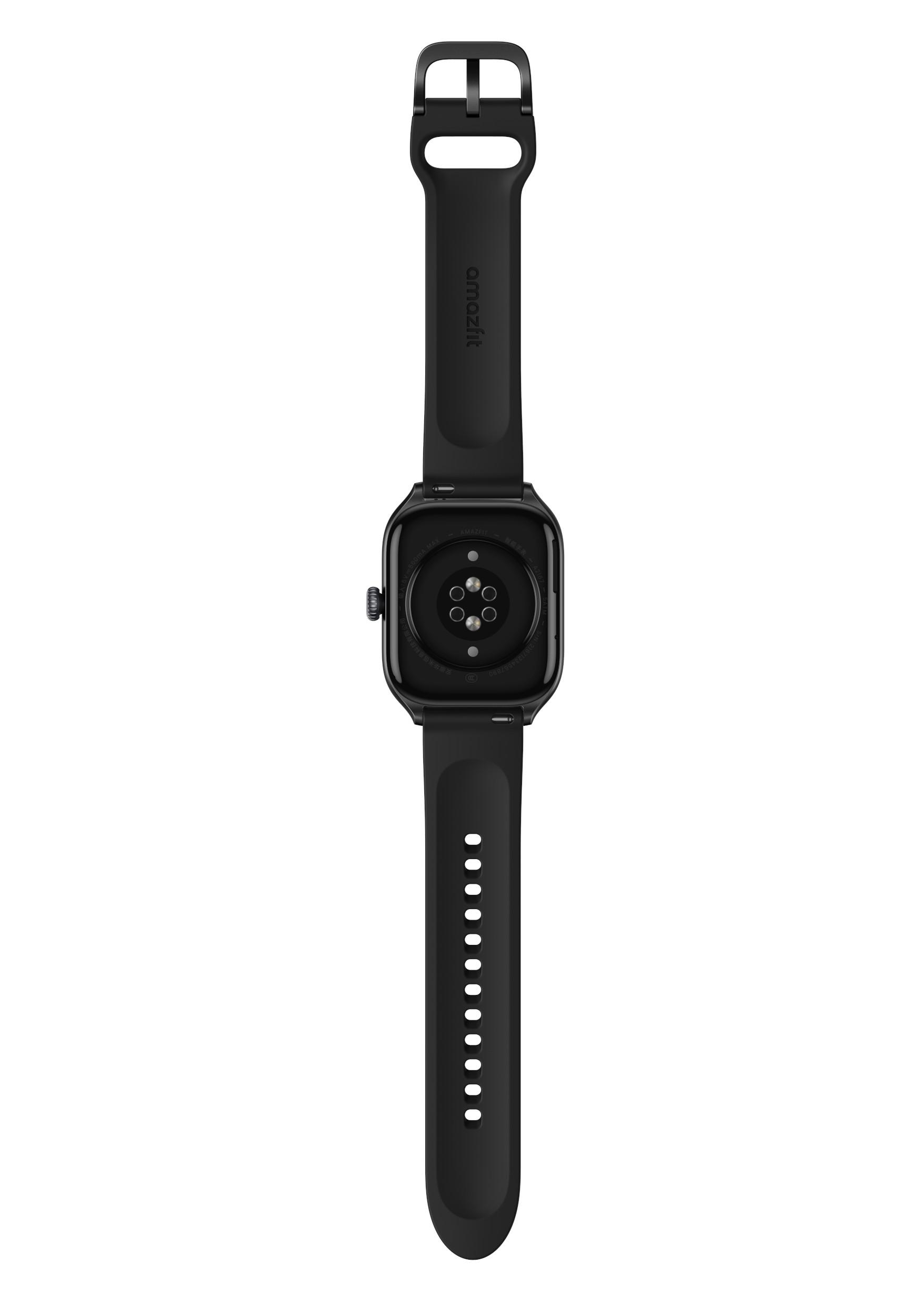 Eine schwarze Smartwatch, die die Unterseite zeigt. Das Armband ist angebracht. Die Rückseite hat Sensoren und Ladekontakte.