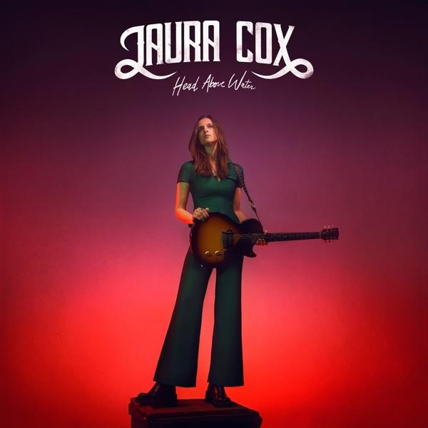Albumcover: Laura Cox. Frau hält eine Gitarre. Roter und violetter Hintergrund.
