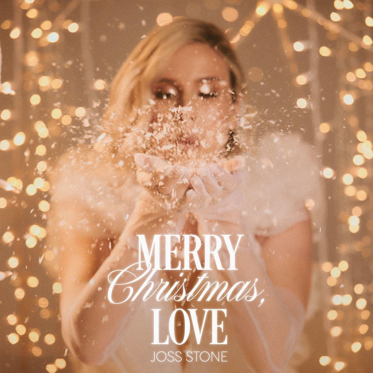 Albumcover: Eine Frau wirft Glitzer. Titel: Merry Christmas, Love von Joss Stone.