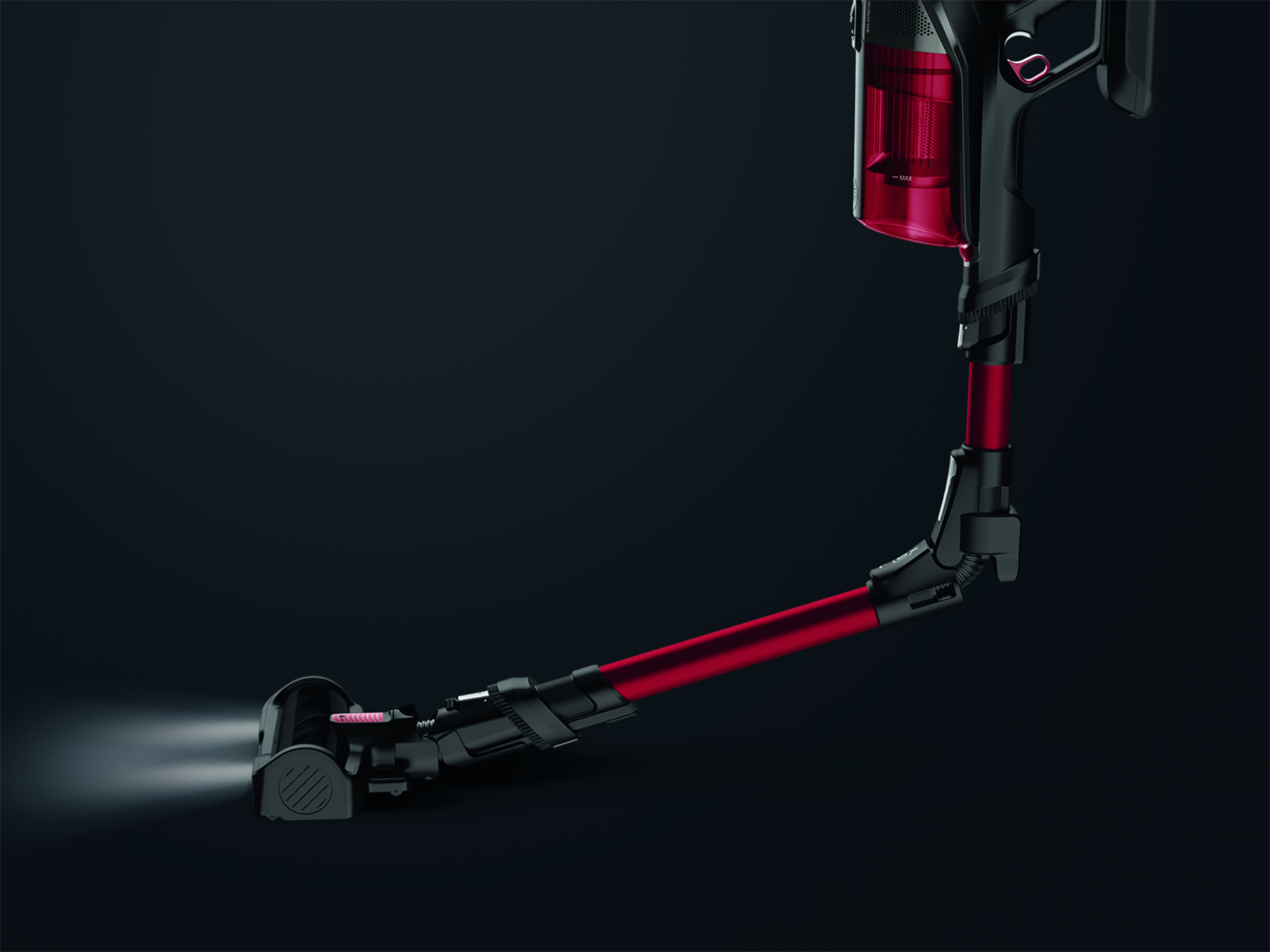Red and black cordless vacuum cleaner. The vacuum is angled, with lights on the front.
