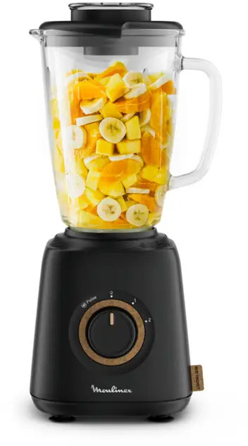 A black blender with fruit inside, in a white background.