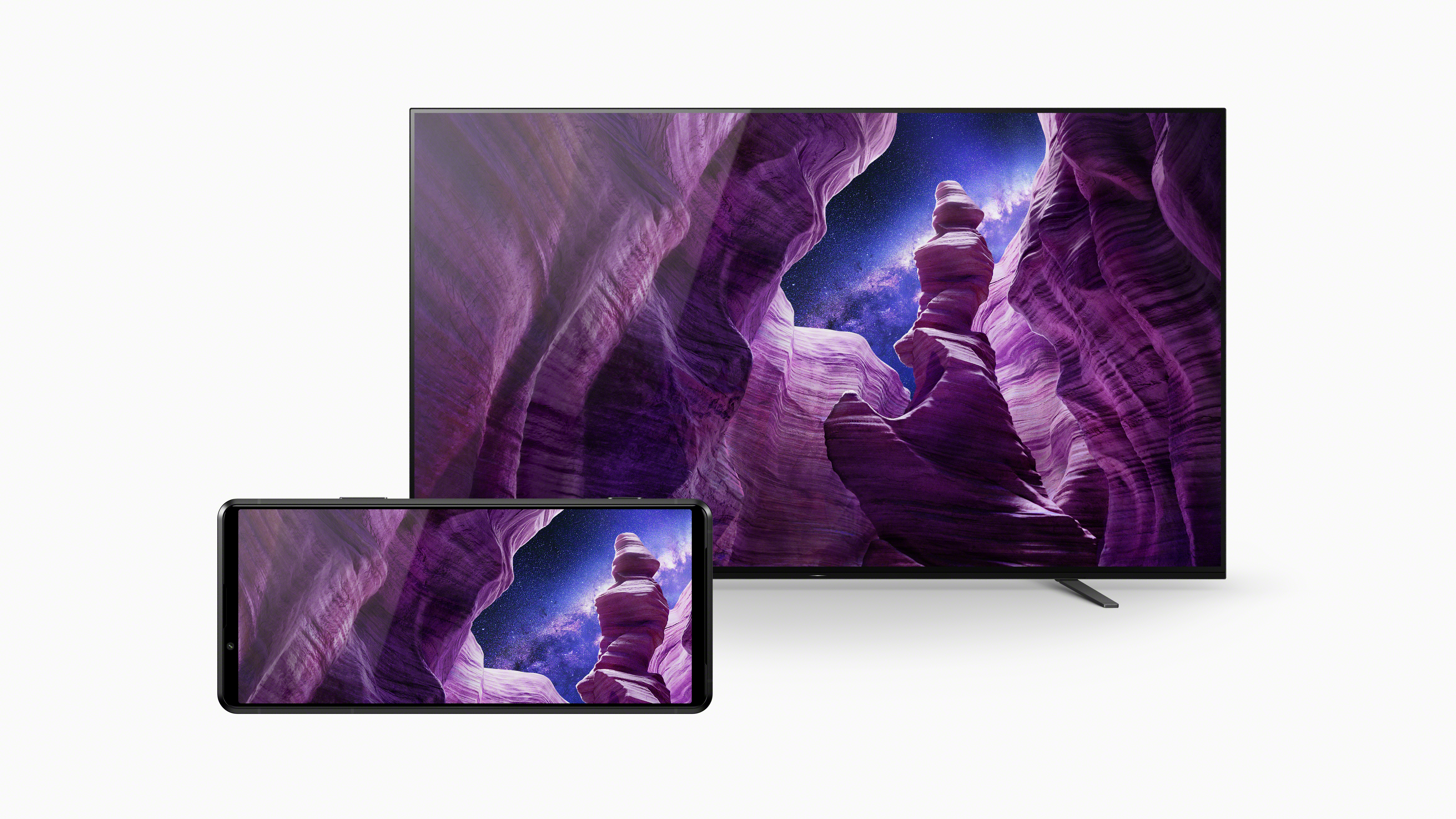 Fernseher und Smartphone zeigen eine lila Schlucht.