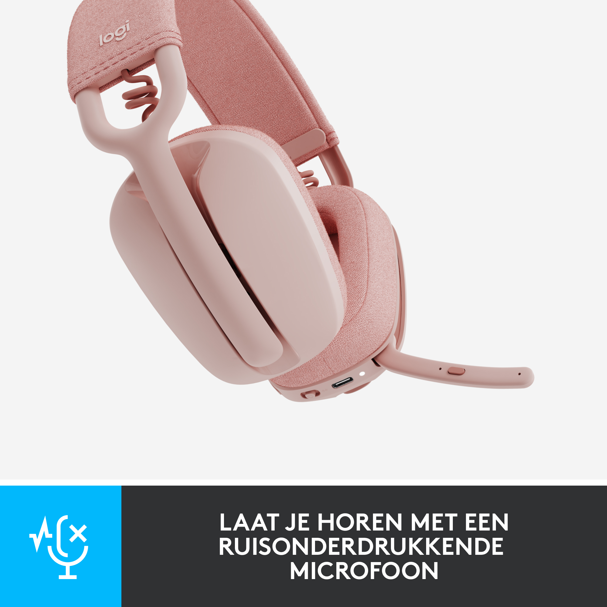 Roze headset met een microfoon. Het merklogo is zichtbaar. De headset ligt op een licht oppervlak.
