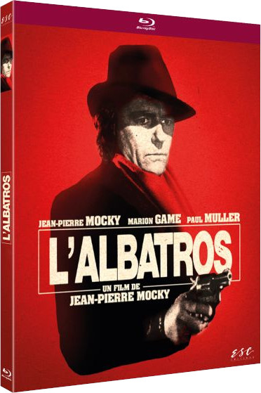 Movie cover for L'Albatros, a man in a hat holding a gun. Red background.