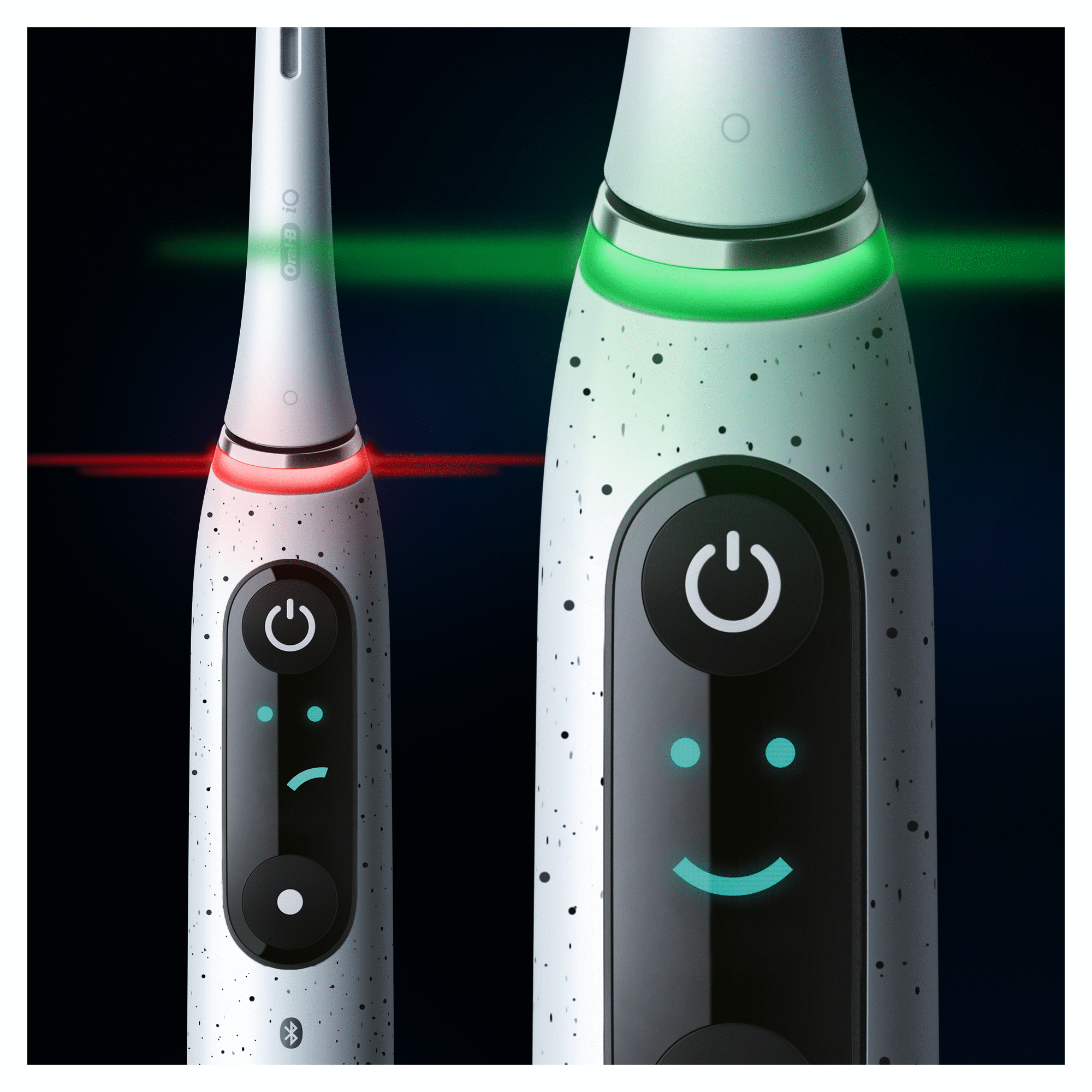 Electric toothbrush on a dark background with two lights.