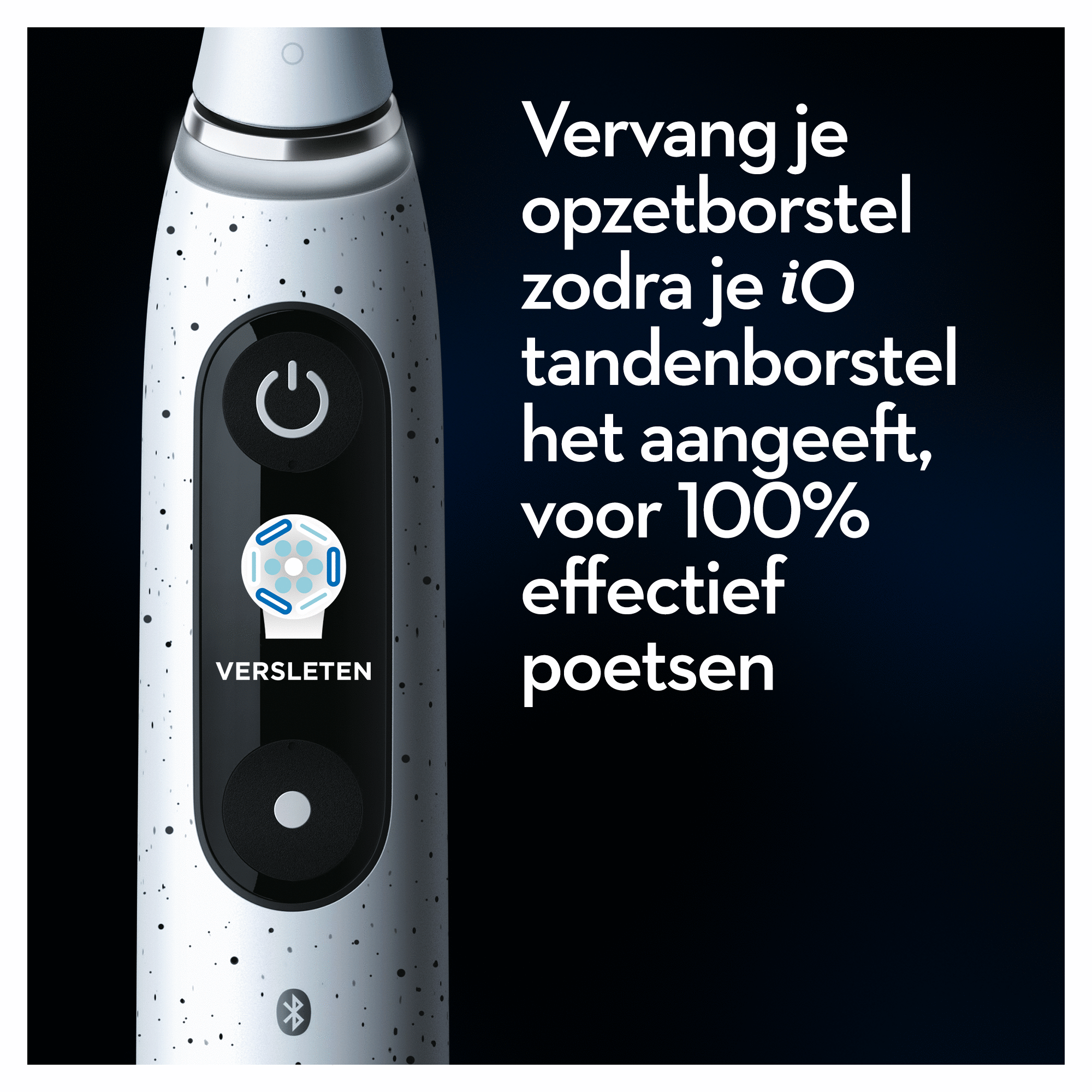 Close-up of an electric toothbrush. It has a power button and a display indicating brush head wear.