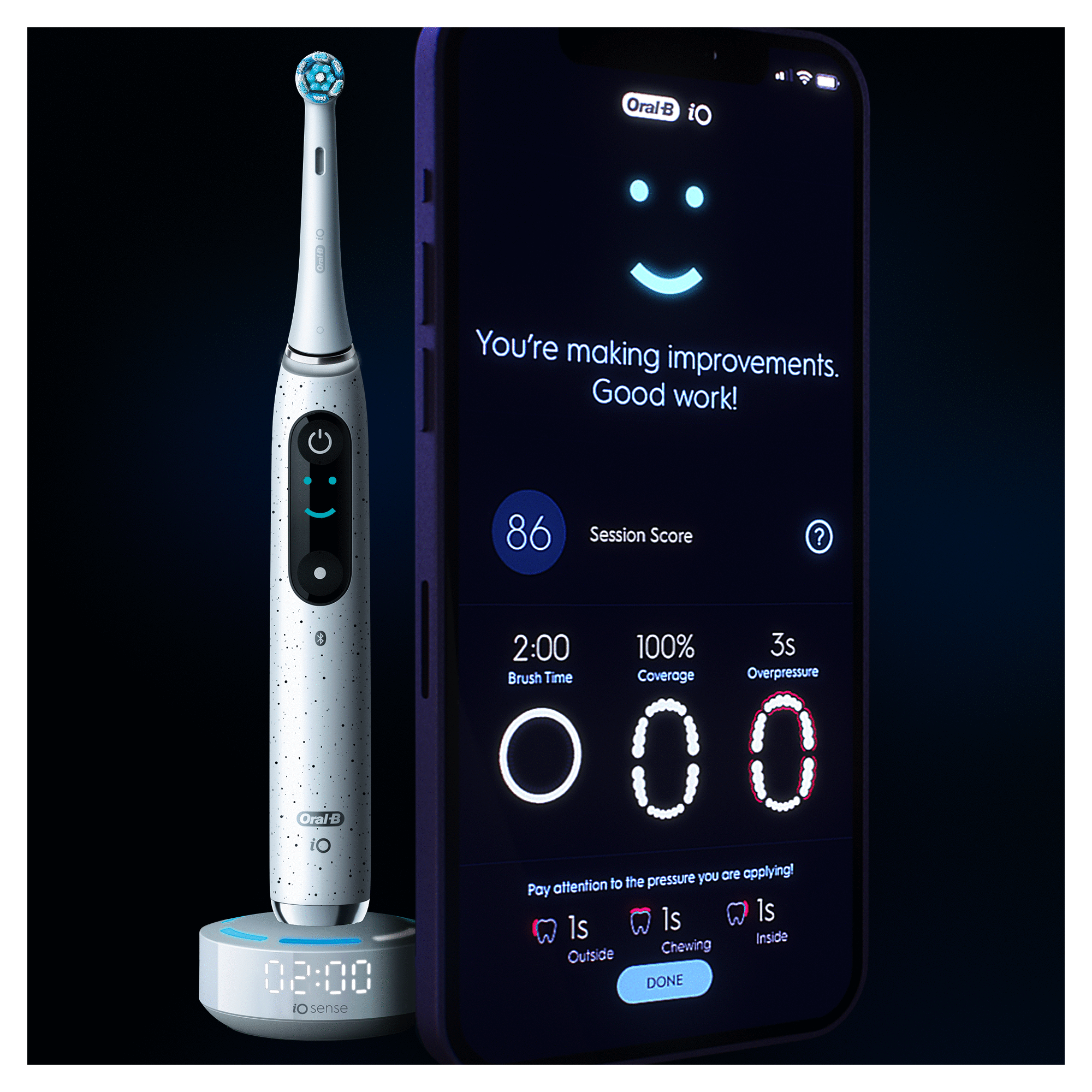An electric toothbrush, charging base and a phone showing a smiley face, session score and stats.