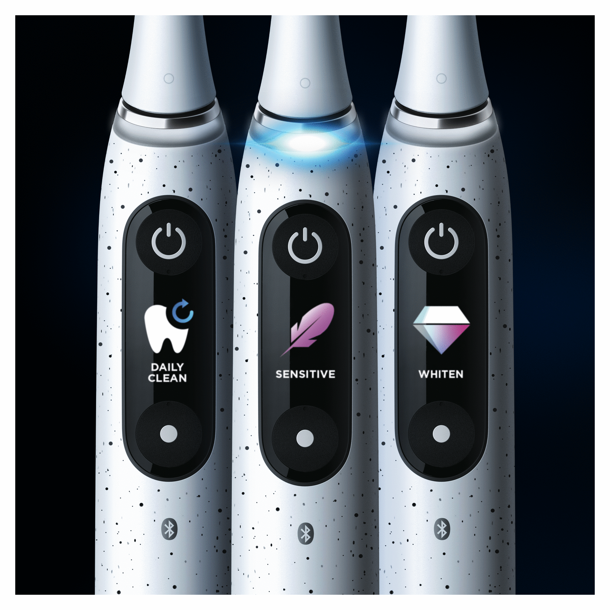 Three white toothbrushes, each with a different mode highlighted.