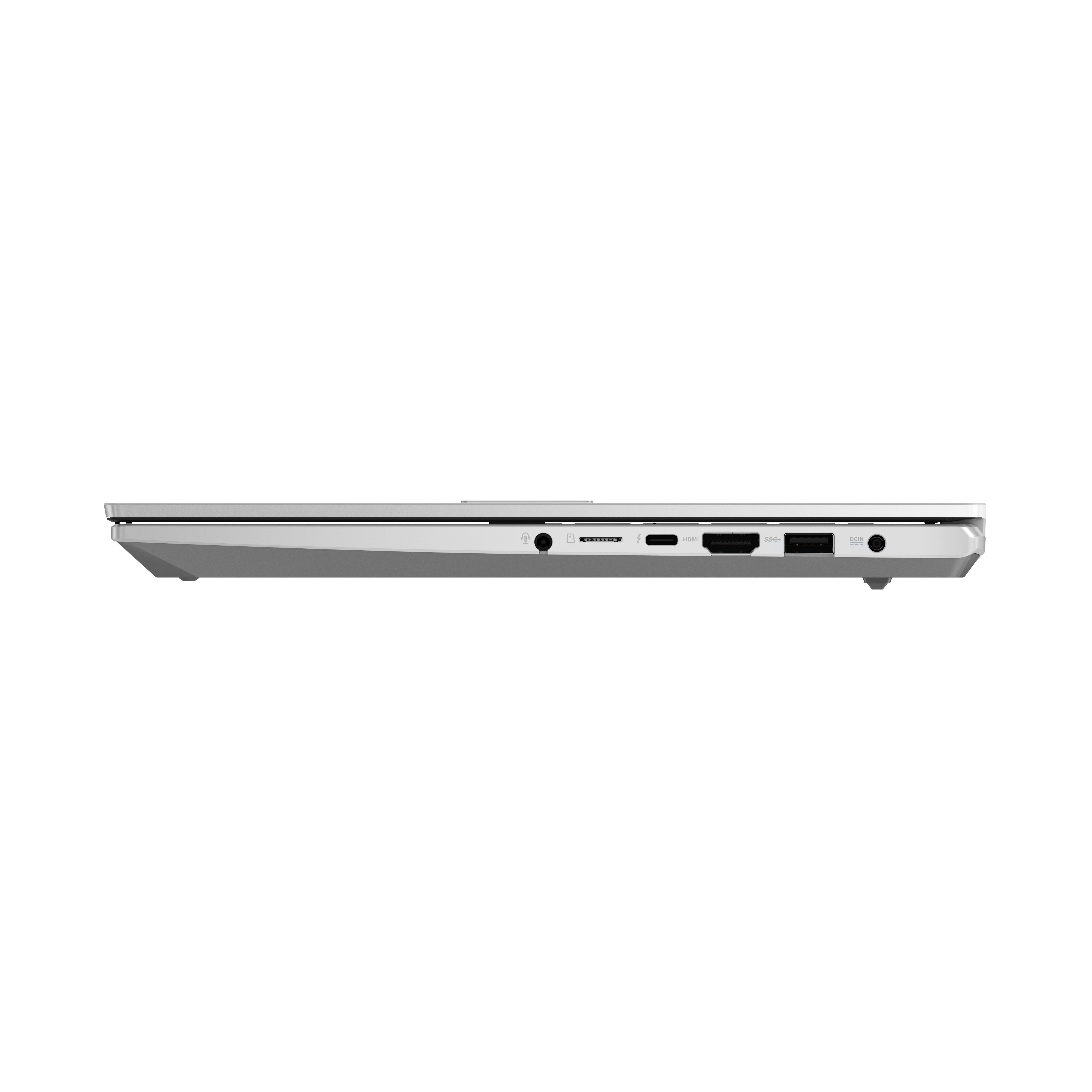 Una vista lateral de un portátil blanco con puertos: tarjeta SD, USB, HDMI y conector de audio.